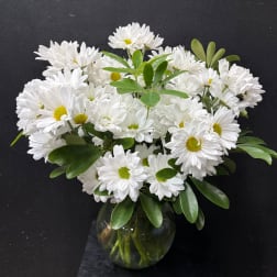 White daisy bouquet in a round glass vase