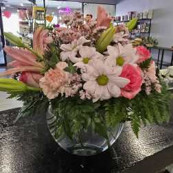 Pink and white mixed bouquet in a clear glass vase