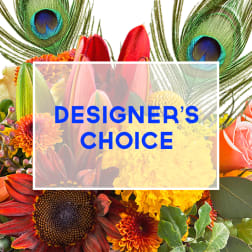 Designer’s choice floral collage with peacock feathers and mixed blooms