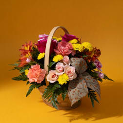 Mixed flower basket with roses, carnations, and yellow mums