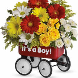 Bouquet of red, yellow, and white flowers in a red wagon