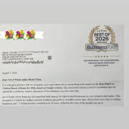 Printed award letter with a floral logo and BusinessRate badge