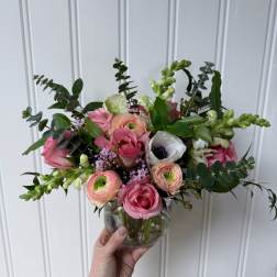 Pink and white mixed bouquet in a clear glass vase
