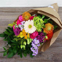 Colorful mixed bouquet wrapped in brown paper