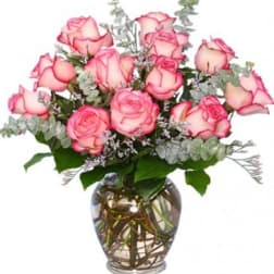 Pink roses arranged in a glass vase