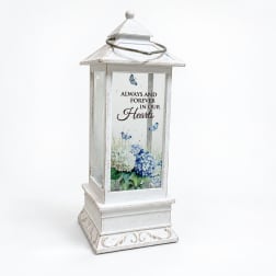 White lantern with blue floral print and memorial text