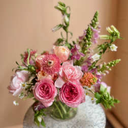 Pink mixed bouquet in a clear glass vase