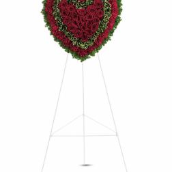 Heart-shaped red rose standing spray on an easel