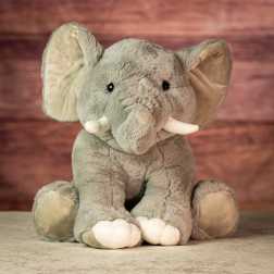 Plush gray elephant toy with white tusks and feet