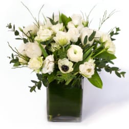 White floral bouquet in a square glass vase