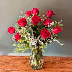 Bouquet of red roses in a clear glass vase