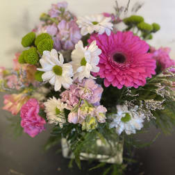 Bouquet of pink and white flowers in a glass vase
