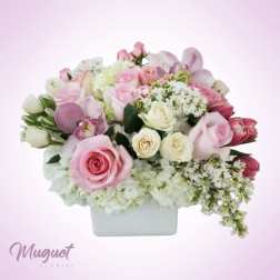 Pink and white rose bouquet in a white rectangular vase
