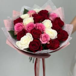 Bouquet of red, pink, and white roses wrapped in pink paper