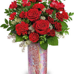 Red roses and carnations in a mosaic vase