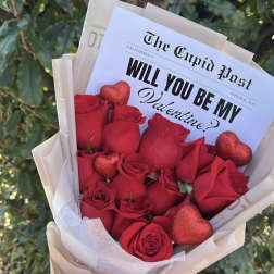 Red rose bouquet with glittery heart decorations and a Valentine card