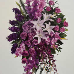 Purple floral standing spray with lilies and roses