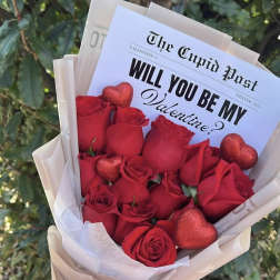 Red rose bouquet with glittery heart decorations and a Valentine card