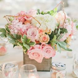 Pink and white rose centerpiece in a wooden box