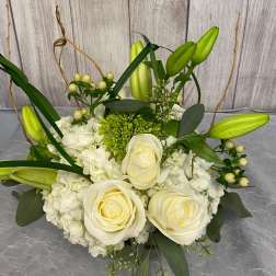 White rose and hydrangea bouquet with green lily buds