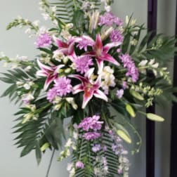 Standing floral spray with pink lilies and lavender flowers