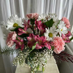 Pink and white mixed bouquet in a clear glass vase