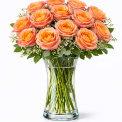 Bouquet of peach roses in a clear glass vase