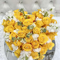 Heart-shaped bouquet of yellow roses and white flowers