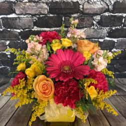 Colorful mixed flower bouquet with roses, gerbera daisies, and carnations