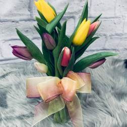 Bouquet of multicolored tulips tied with a sheer ribbon