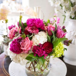 Pink and white mixed bouquet in a clear glass vase