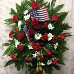 Red and white floral standing spray with American flags