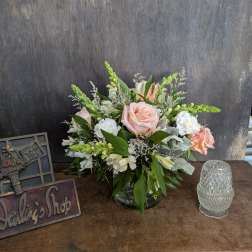 Pink and white floral arrangement in a glass vase