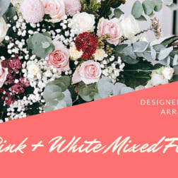 Pink and white mixed flower arrangement with roses and round blooms