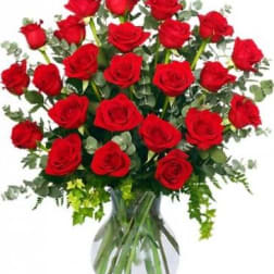 Bouquet of red roses in a clear glass vase