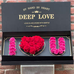 Black gift box with red and pink roses arranged as "I LOVE U"