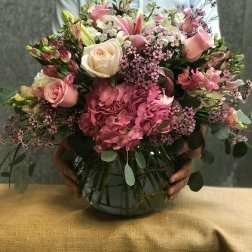 Pink and white mixed bouquet in a glass vase