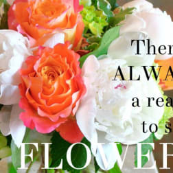 Bouquet of orange and white roses with green hydrangeas and text overlay