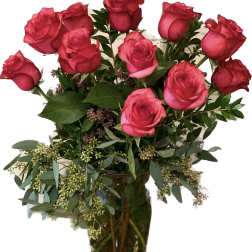 Pink rose bouquet in a clear glass vase