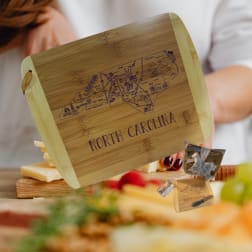 Wooden cheese board engraved with North Carolina map and text