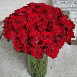 Bouquet of red roses in a clear glass vase