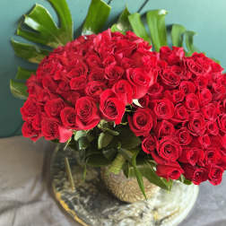 Large bouquet of red roses in a glass vase