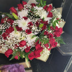 Bouquet of red roses and white chrysanthemums with baby's breath