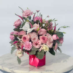 Pink mixed bouquet in a bright pink box with a ribbon