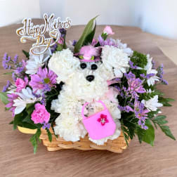 White and pink flower basket with a teddy bear and Mother's Day sign