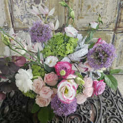Mixed bouquet of pink and white flowers with purple blooms