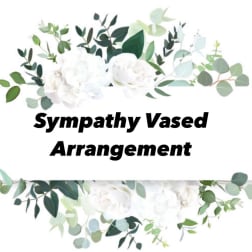 White floral sympathy arrangement with eucalyptus and greenery