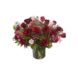 Bouquet of red and pink roses in a glass vase