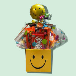 Candy gift box with a smiley-face balloon and assorted snack bars