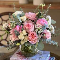 Pink and white rose bouquet in a glass vase